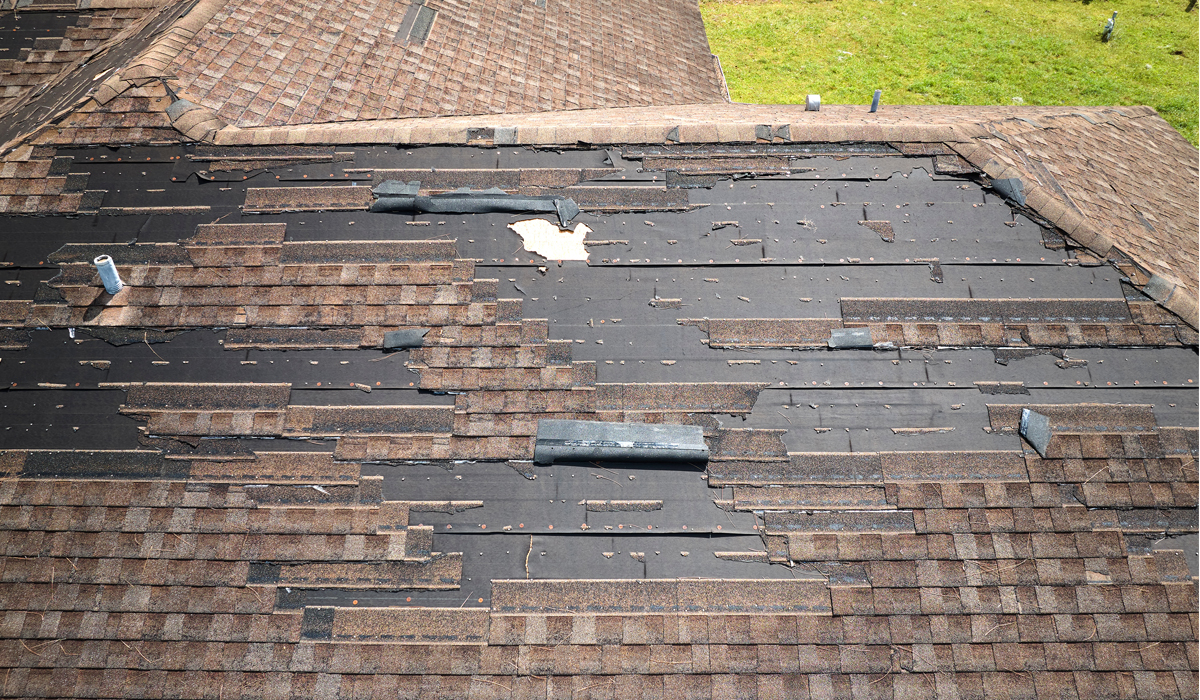 Damaged roof shingles. Find local storm damage roof repairs.