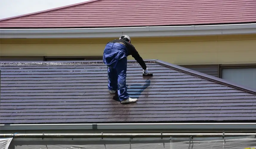 Professional application of Cool Roof Coatings on residential building.